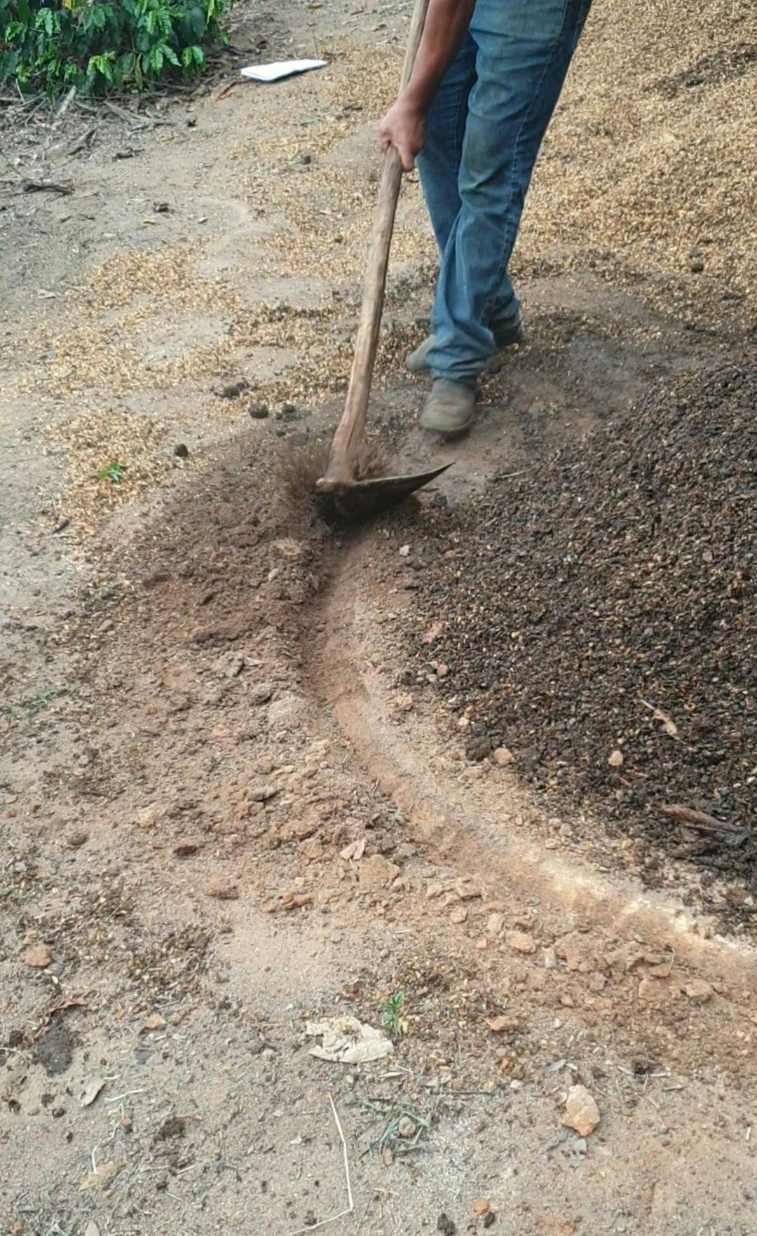 Digging a canal around the pile